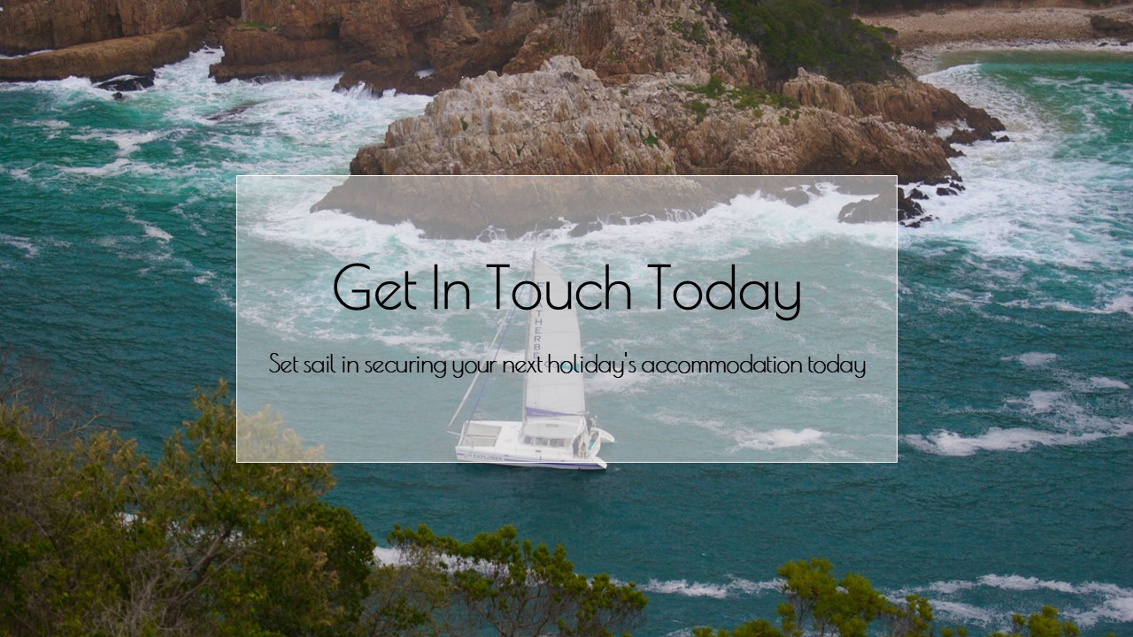 This is a personally shot photo of a boat sailing through the Knysna Heads.